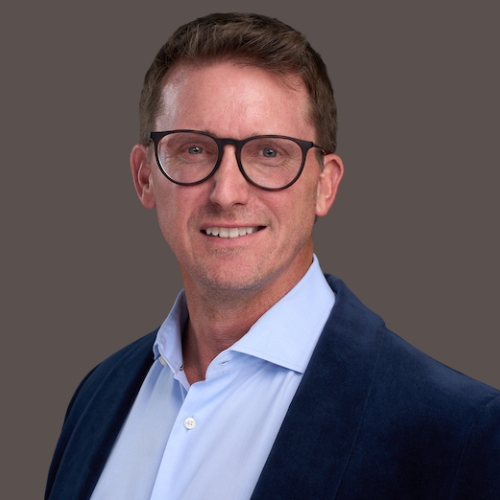 Emannuel St Germain, CEO of Choice Mortgage Group in blue button down shirt and blue jacket
